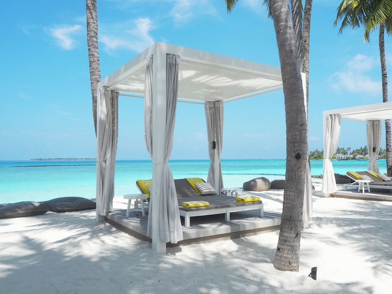 Sun lounges by the main pool Cheval Blanc Maldives