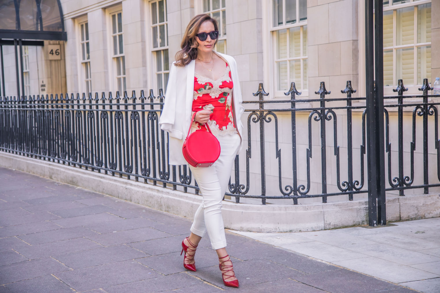 How to dress up white trousers with lace Dolce & Gabbana top