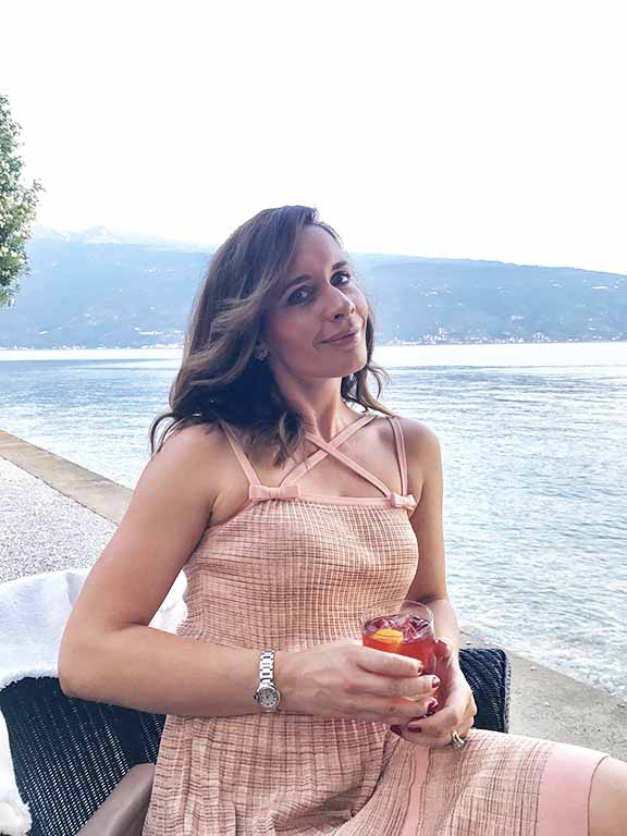 Petra Brisby of Chic Journal blog enjoying drink at Villa Feltrinelli 