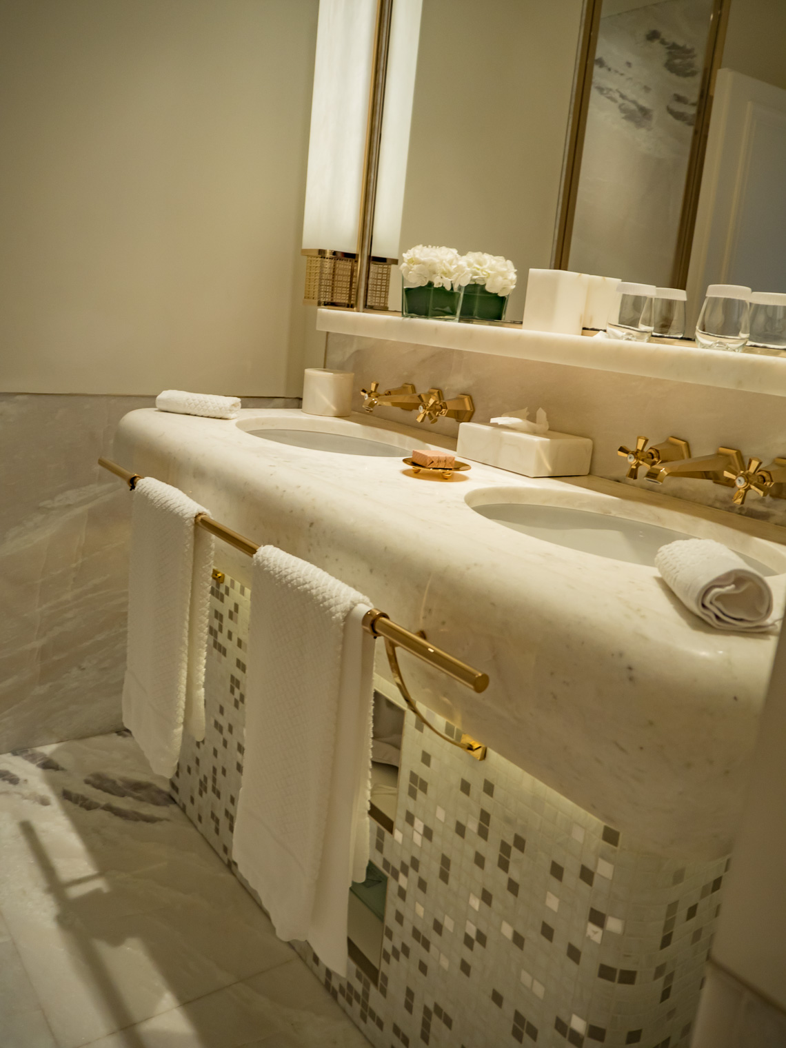 Luxury bathroom white marble with gold taps at hotel Eden Rome